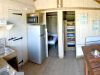 Eco-chalet interior — living area and fitted kitchen, Détente et Clapotis campsite Lac de Paladru